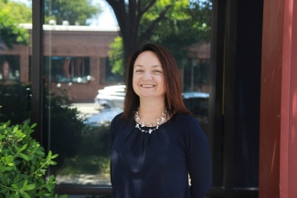 Ms. Curtis standing outside the legal office
